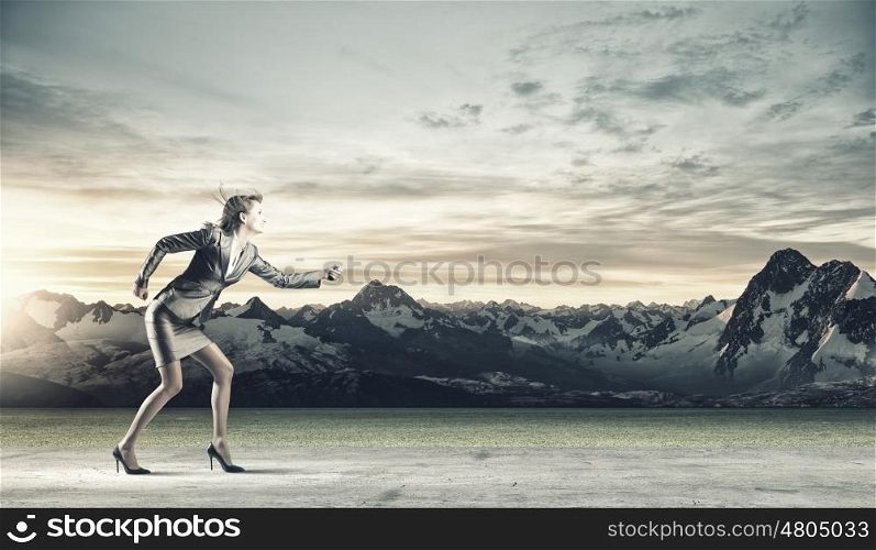 Running businesswoman. Young businesswoman in suit running in a hurry