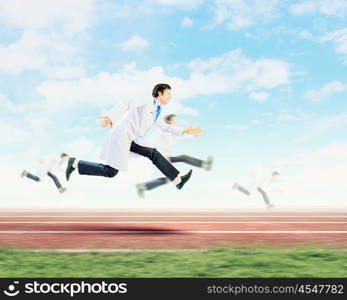 Running doctor. Funny image of young running doctor in white uniform
