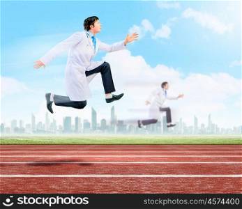 Running doctor. Funny image of young running doctor in white uniform