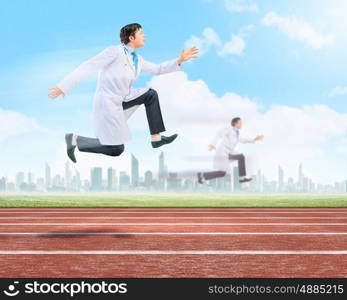 Running doctor. Funny image of young running doctor in white uniform