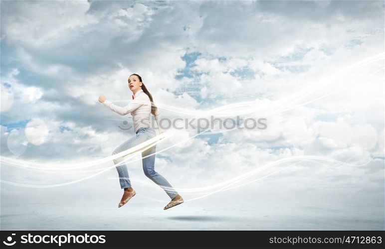 Running girl. Young woman in casual running in a hurry