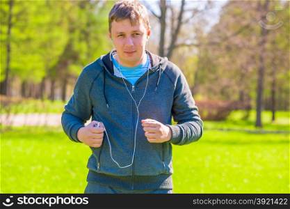 running man in the park listening to music
