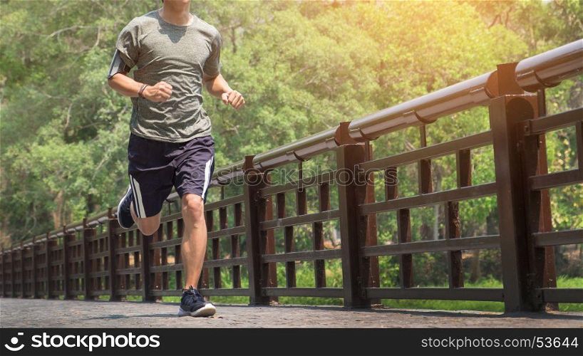 running man. Male runner at sprinting speed training for marathon outdoors.