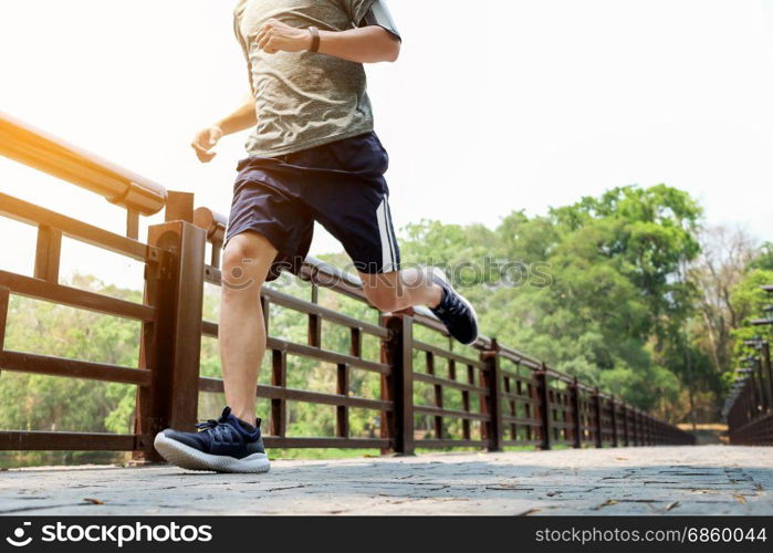 running man. Male runner at sprinting speed training for marathon outdoors.