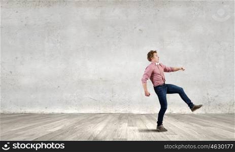 Running man. Young man in casual running away from something