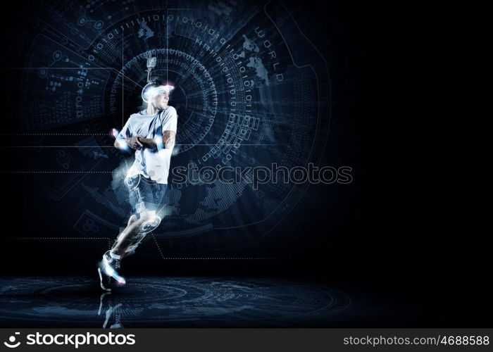 Running man. Young running man against digital media background