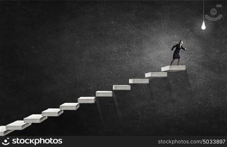 Running on career ladder. Young businesswoman running up staircase representing success concept