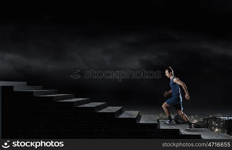 Running sportman . Young man athlete in blue wear running outdoor