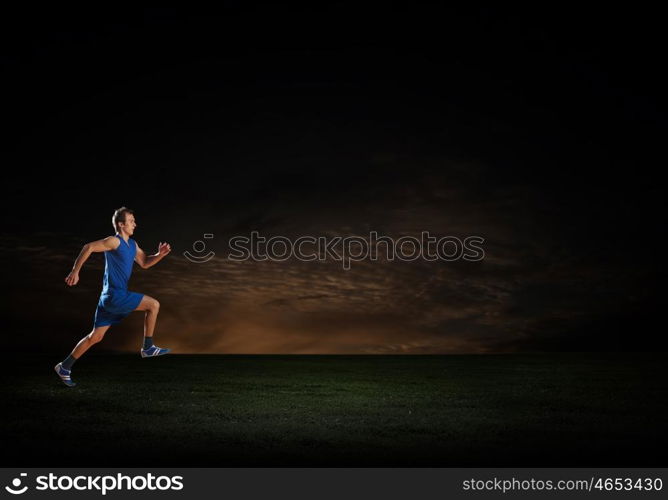 Running sportman . Young running man athlete in blue wear