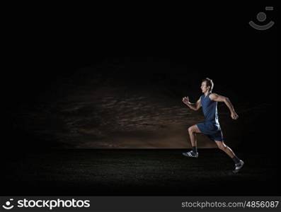 Running sportman . Young running man athlete in blue wear