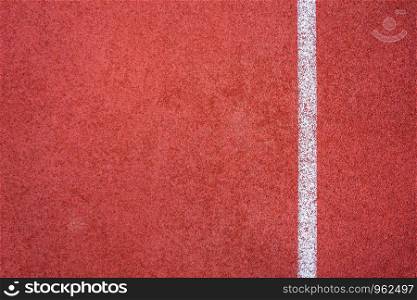 Running track red ground rubber cover texture background.