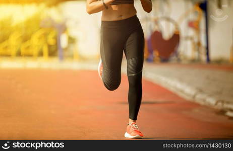 Running woman. Female runner jogging during outdoor on road .Young mixed race girl jogging