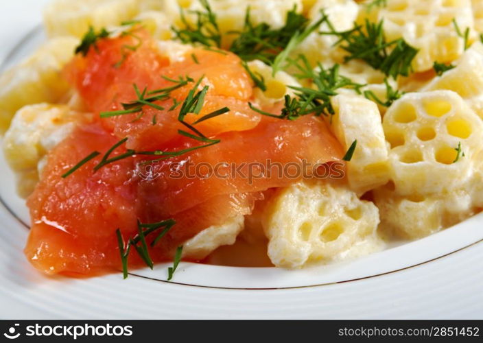 ruote pasta with cream sauce and salmon.closeup