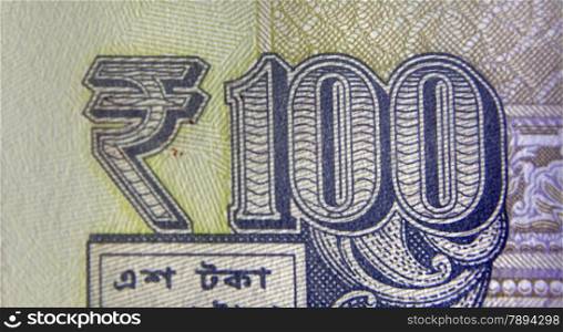 Rupee Symbol on Hundred rupee banknote