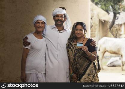 Rural farmer family holding credit card