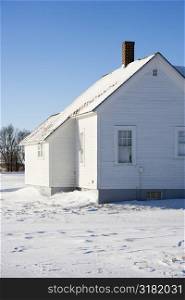 Rural house in snow.