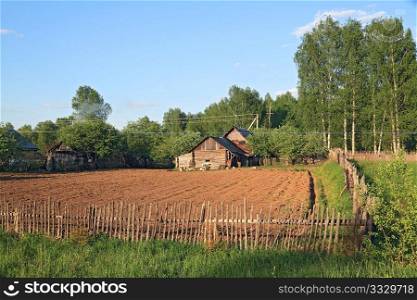rural house near plow field