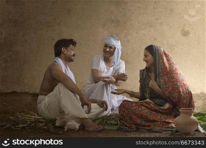 Rural Indian family sitting together and talking