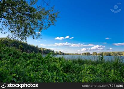 Rural landscape of sandy pit flooded with water. Russia, Yaroslavl