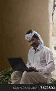 Rural man using laptop