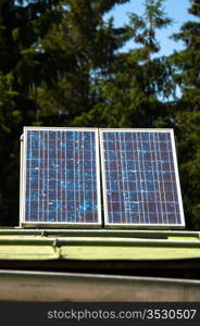 Rural mountain cabin with solar panels to ensure basic electricity off-site in the Bavarian Alps