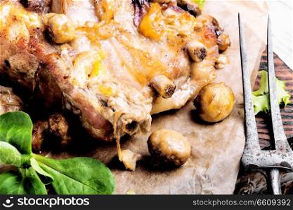 Rural recipe baked meat with mushrooms.Baked pork. Baked meat with forest mushrooms