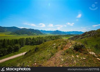 Rural road in mountains in Karakol valley, Altay, Siberia, Russia. Rural road in mountains
