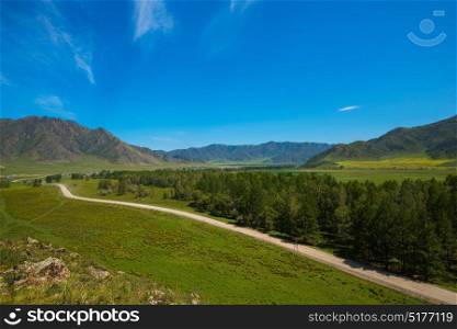 Rural road in mountains in Karakol valley, Altay, Siberia, Russia. Rural road in mountains