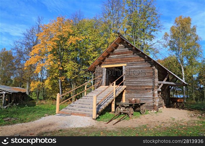 rural stable in autumn grove