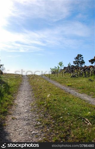 Rural tracks at blue sky with white clouds.
