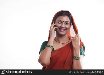 Rural woman talking on mobile phone