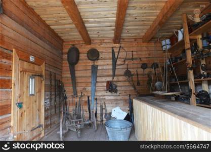 rural work tools, hung on walls of barn