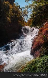 Rush strong water of Datanla Waterfall and forest in Dalat, Vietnam in spring season. Famous nature attraction in Dalat