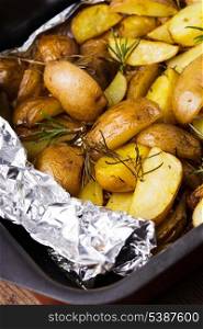 Rusic style potato with rosemary baked in foil