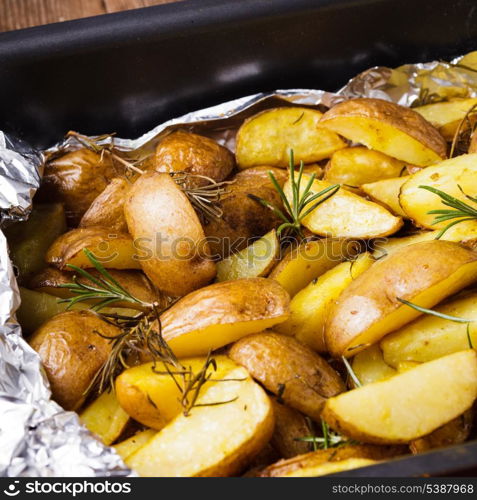 Rusic style potato with rosemary baked in foil