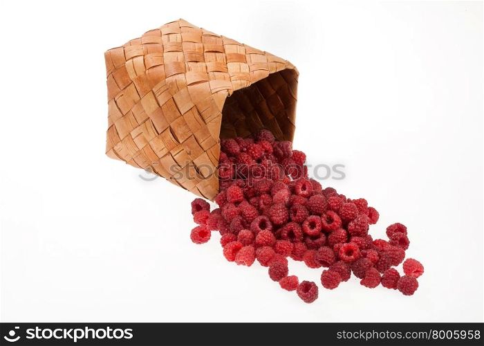 Rusiian national wooden container with raspberries on isolated studio background