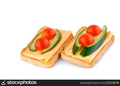 Rusk sandwiches with tomato, cucumber and cheese isolated on white background.