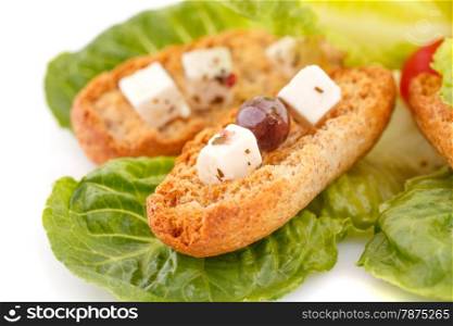 Rusks, feta cheese and vegetables on white background.