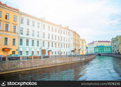 Russia, St. Petersburg - 15th June 2020: Ancient streets and embankment with the Neva River in the city of St. Petersburg in Russia. Ancient streets and embankment with the Neva River in the city of Saint Petersburg