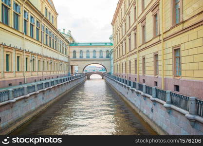 Russia, St. Petersburg - 15th June 2020: View of canal in beautiful city in Saint Petersburg. Channel near The Buildings Ermitage Museum. View of canal in beautiful city in Saint Petersburg. Buildings from both sides of the river.