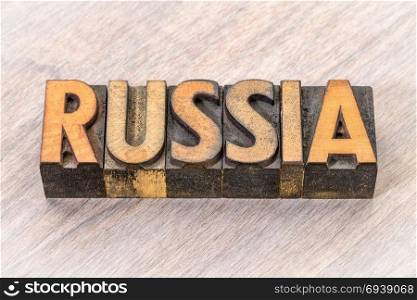 Russia word in vintage letterpress wood type against grained wood