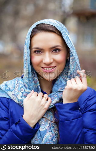 Russian beauty woman in the national patterned shawl