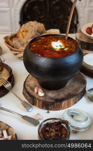 Russian borsch at pot. Russian borsch at pot on the table