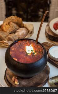 Russian borsch at pot. Russian borsch at pot on the table