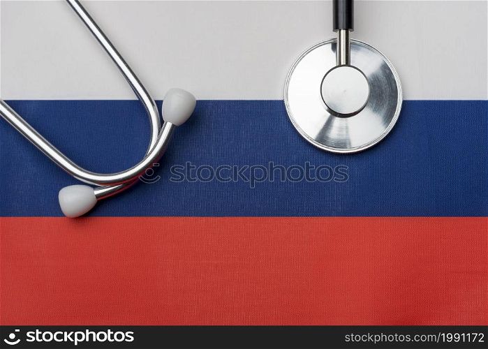 Russian flag and stethoscope. The concept of medicine. Stethoscope on the flag in the background.. Russian flag and stethoscope. The concept of medicine.