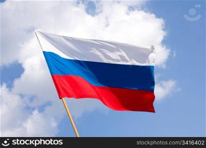 Russian flag on a background blue sky