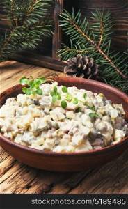 Russian meat salad Olivier. traditional Russian salad Olivier, with meat and vegetables.