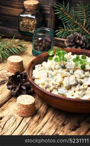 Russian meat salad. Traditional Russian meat salad Olivier, with meat and vegetables.
