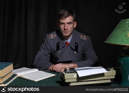 Russian military officer in a dark cabinet