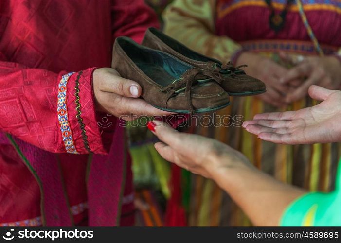 Russian old-fashioned wedding. Ol tradition, the husband sends his future wife a gift - shoes.